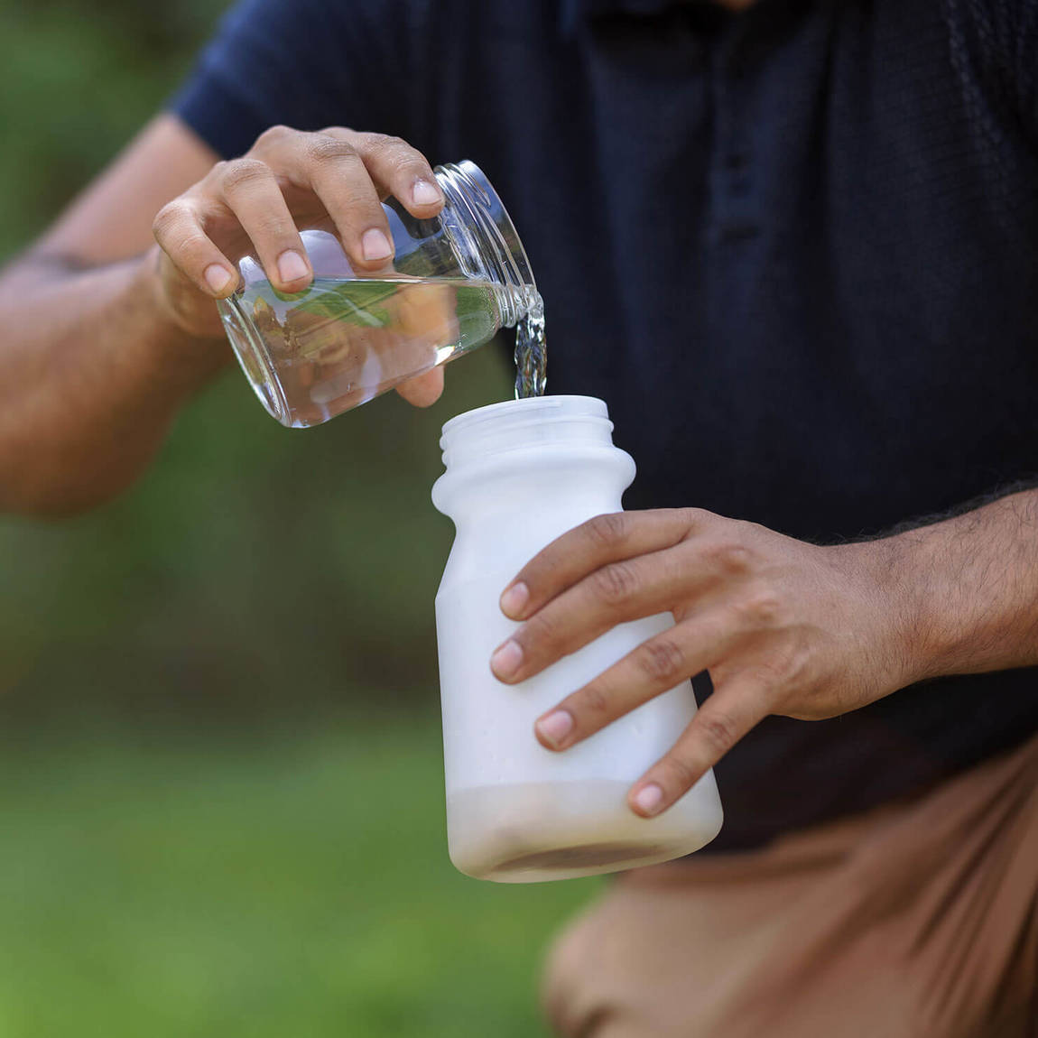 Add room temperature water to fill sprayer bottle